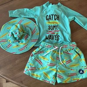 3 piece surfboard  swim trunks, rash guard, sun hat